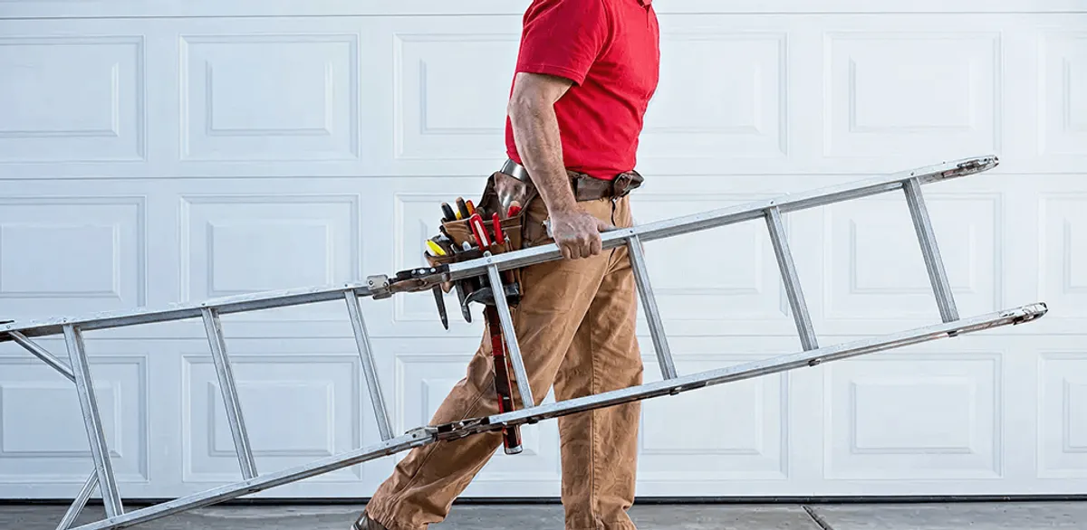 Garage door repair technician arriving with tools and ladder in Orlando, FL